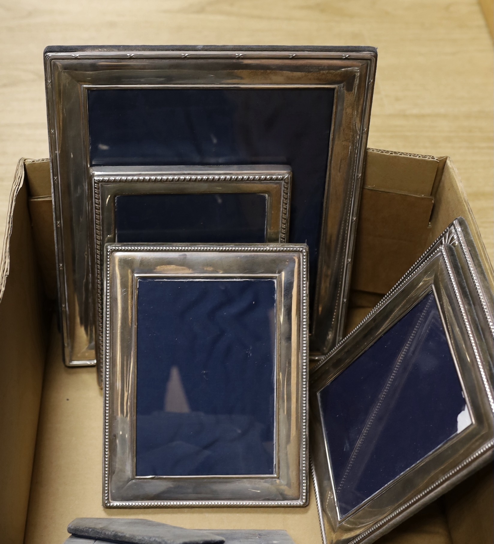 Nine assorted modern silver mounted photograph frames, including one pair, largest 32cm.